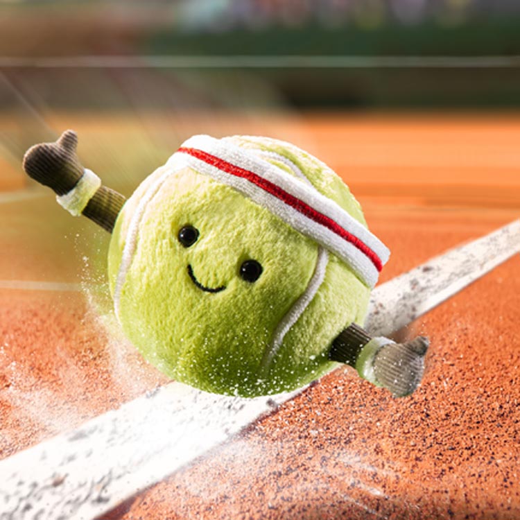 Jellycat Amuseable Sports Tennis Ball  in action on the Tennis Court