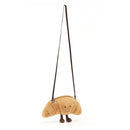 Jellycat Amuseable Croissant Bag showing carry strap
