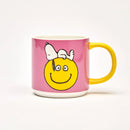 Snoopy and Peanuts Have a Nice Day Mug showing Snoopy crashed out on top of a big smiley face