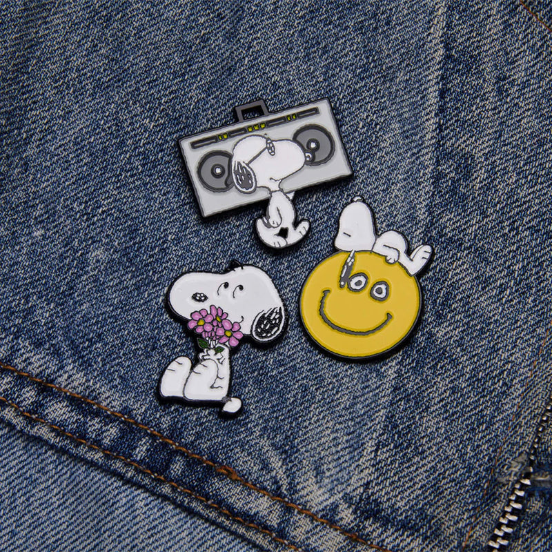Peanuts Music is Life Enamel Pin - DJ showing a selection of Snoopy pins
