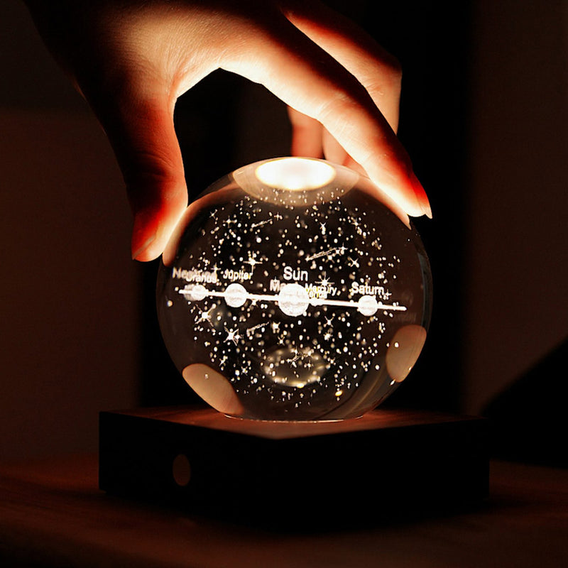 Illuminated Gingko Crystal Ball with solar system inside