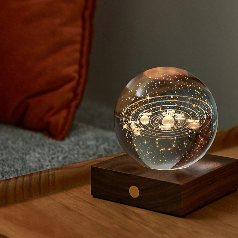 Illuminated Gingko Crystal Ball with solar system inside