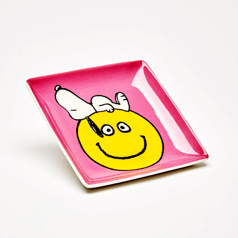 Peanuts Have a Nice Day Trinket Tray showing Snoopy crashed out ontop of a smily face emoji
