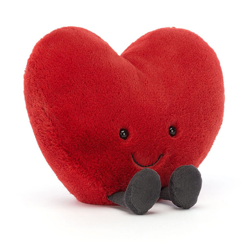 Jellycat Amuseable Red Heart with smiley face and little feet shown in front view