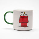 Peanuts Gang and House Mug depicting Snoopy lying atop his house